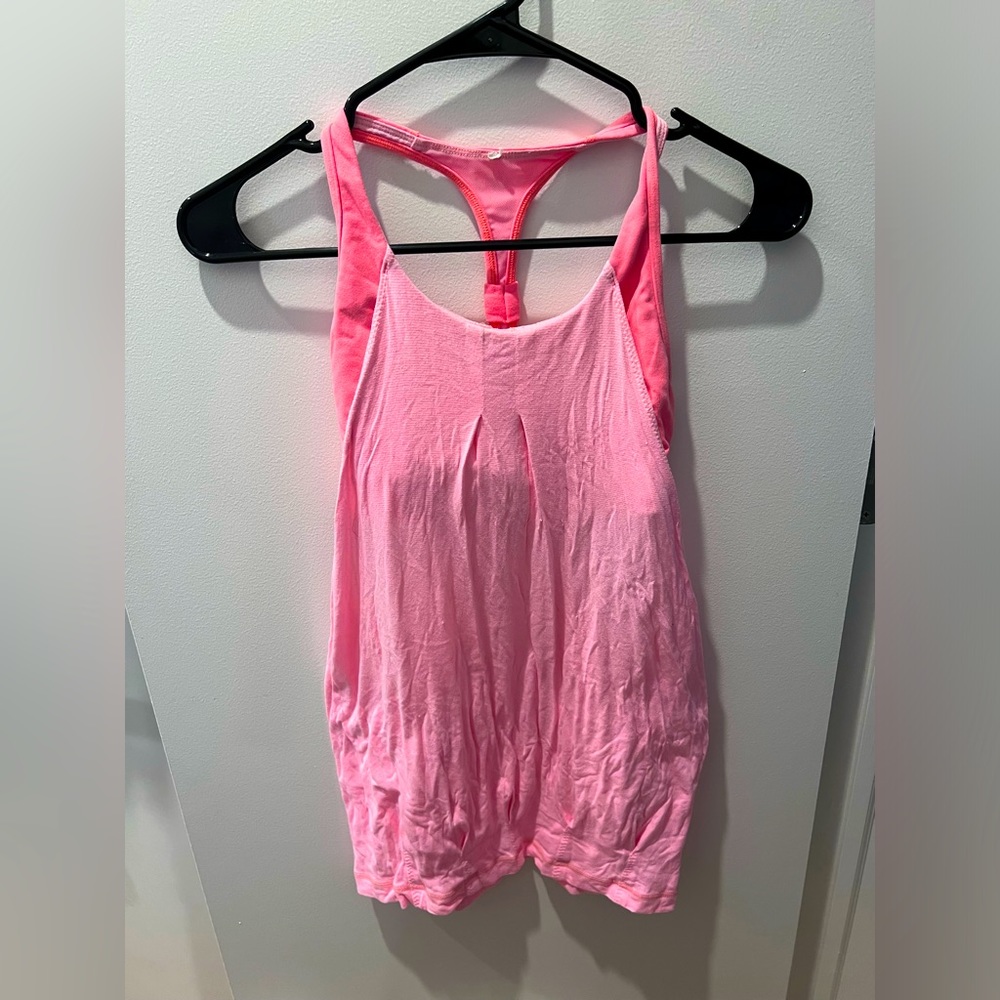 Pink Lululemon workout top with built in sports bra